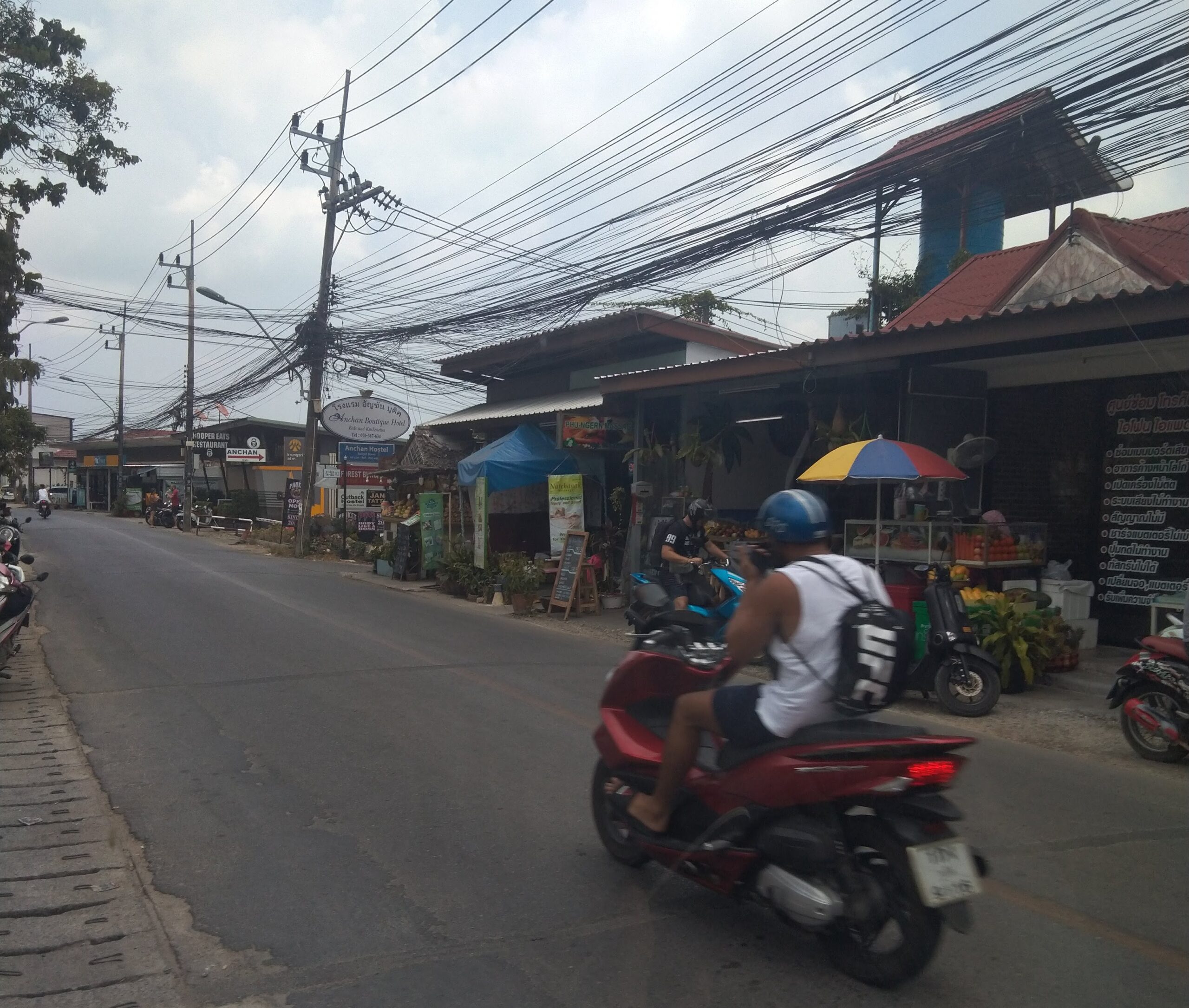 View of Soi Ta-aid with numerous health stores and gyms